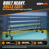 Thumbnail for Empty standard gym floor cover storage rack with eight galvanized steel rollers on locking wheels in a gym
