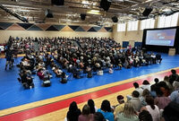 Thumbnail for Royal blue gym floor covering during a school event
