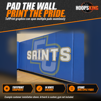 Thumbnail for Blue gym wall pads printed with a large Saints wordmark over a pale logo along a hardwood gymnasium floor