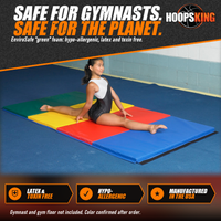 Thumbnail for Young gymnast in a split on a green, yellow, red and blue folding tumbling mat on a blue gym floor