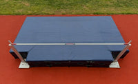 Thumbnail for Overhead view of a high jump landing mat with standards and bar set up on a track and field runway.