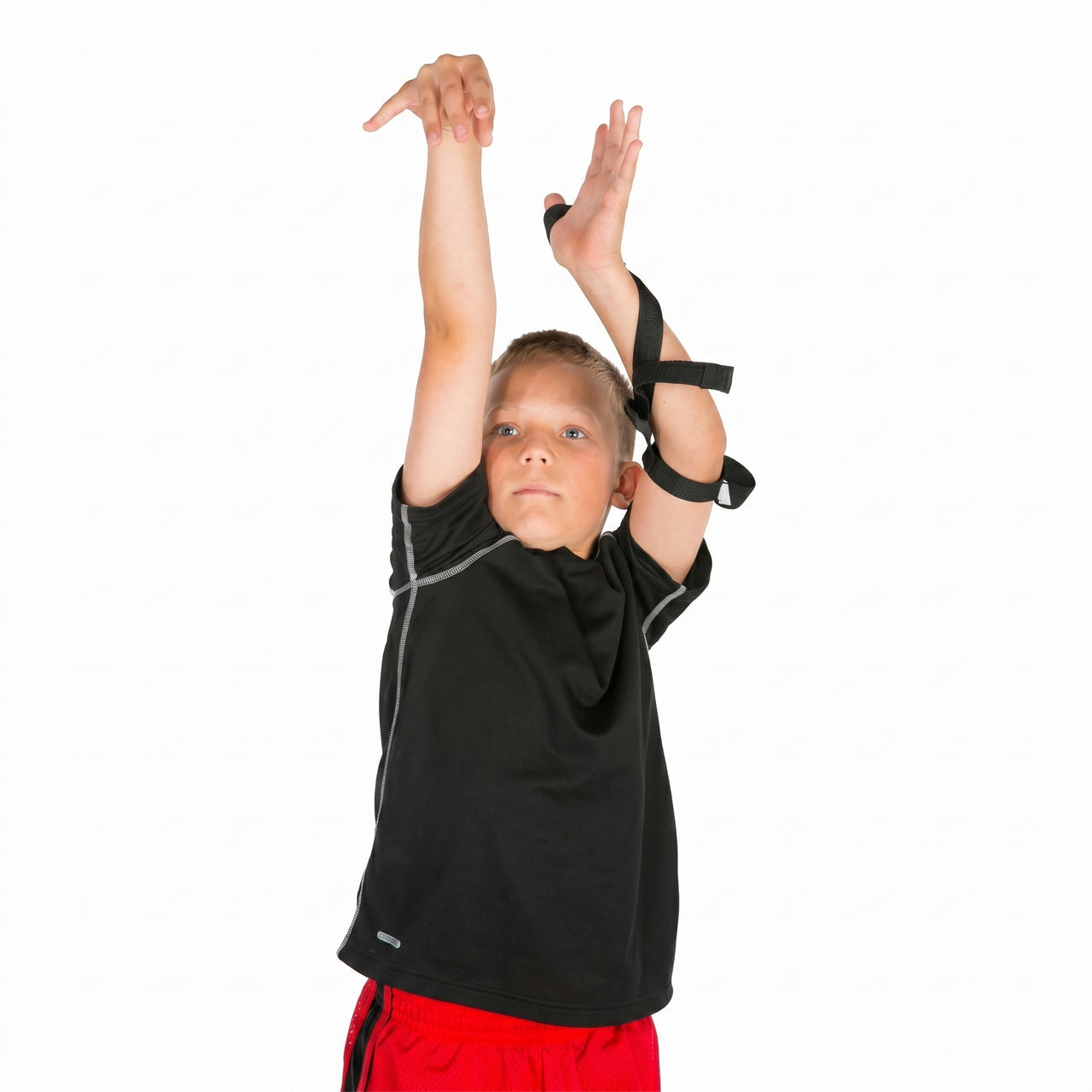 Youth basketball player using HoopsKing shooting aid to practice proper shooting form and follow through