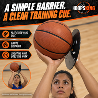 Thumbnail for Female basketball athlete demonstrating the Smooth Shooter flat guide-hand disc between her guide hand and the basketball.