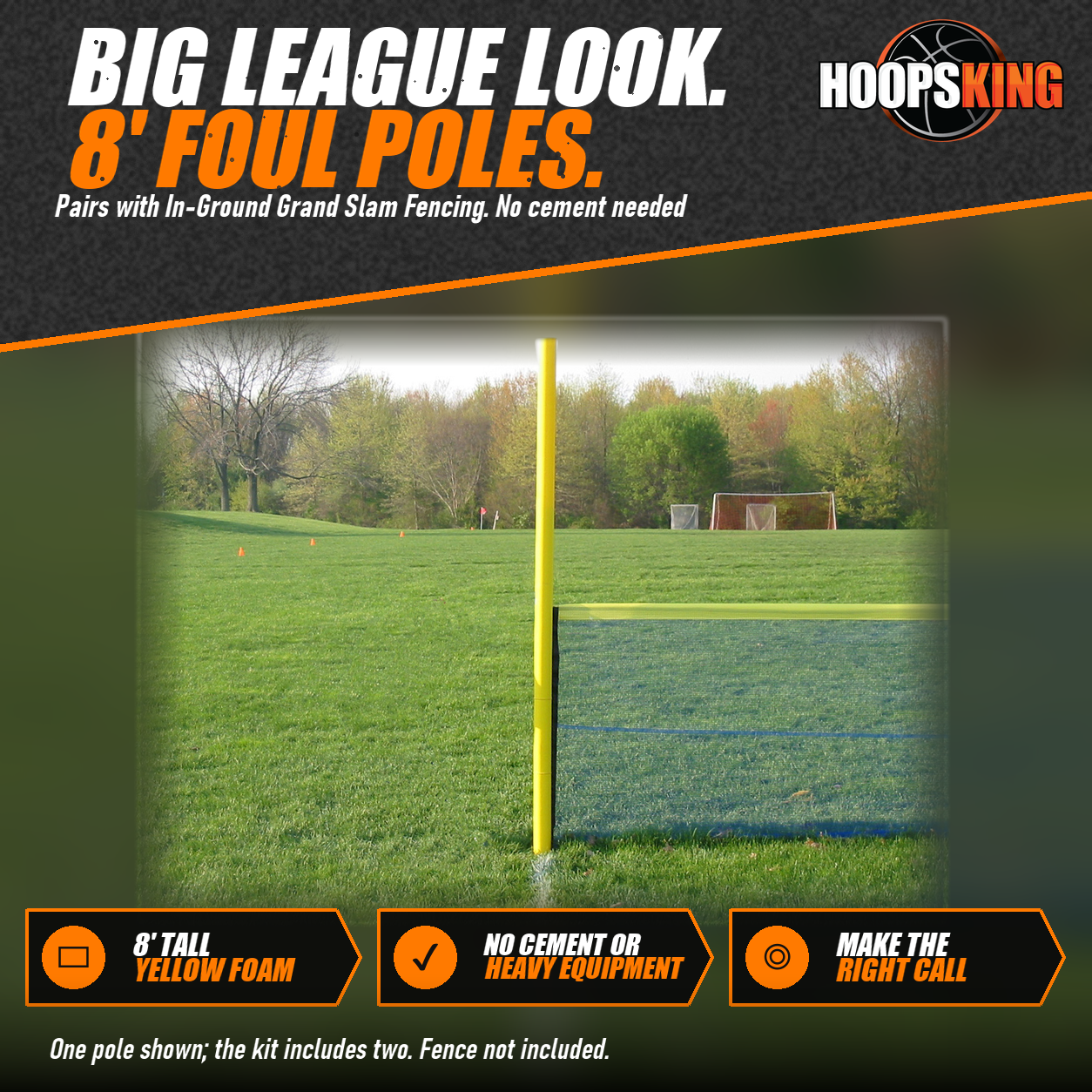 Tall yellow foam foul pole standing at the end of a green mesh outfield fence on a grass field