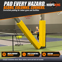 Thumbnail for Yellow padding wrapped around an angled steel beam and an upright column beside indoor pickleball courts