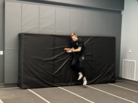Thumbnail for Black indoor track pad with high-density foam core for pole vault and high jump training