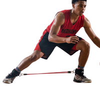 Thumbnail for Athlete in red and black uniform using red lateral resistance bands attached to ankle straps.