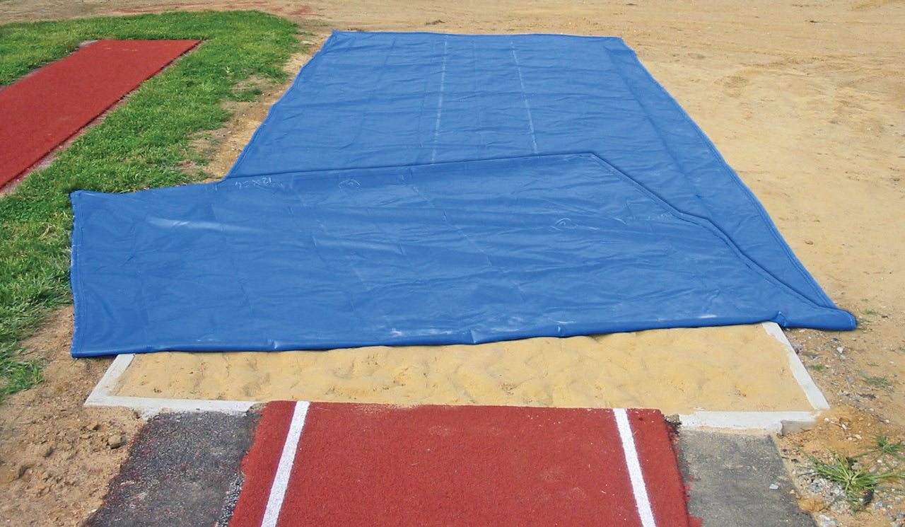 FieldSaver weighted long jump sand pit cover folded back to reveal built-in weighted perimeter edge that secures jump pit cover without stakes or sandbags