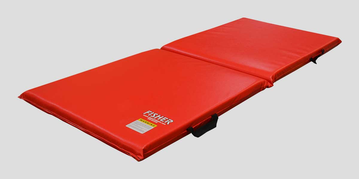Red folding personal mat with "FISHER" logo and warning label.