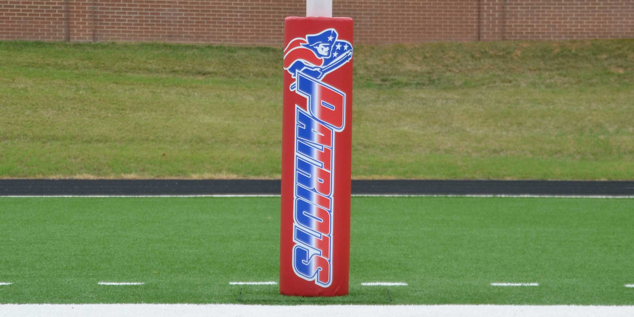 Red full digital print goal post pad on a football field
