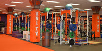 Thumbnail for Orange beam pads with "COMMITMENT", "UNITY", and "ATTACK" text in a gym with weight racks.