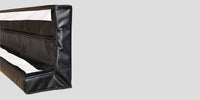 Thumbnail for Black corner pad with white stripes and a zipper closure.