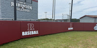 Thumbnail for Red wall panels with "R BASEBALL" in white on a sports field.