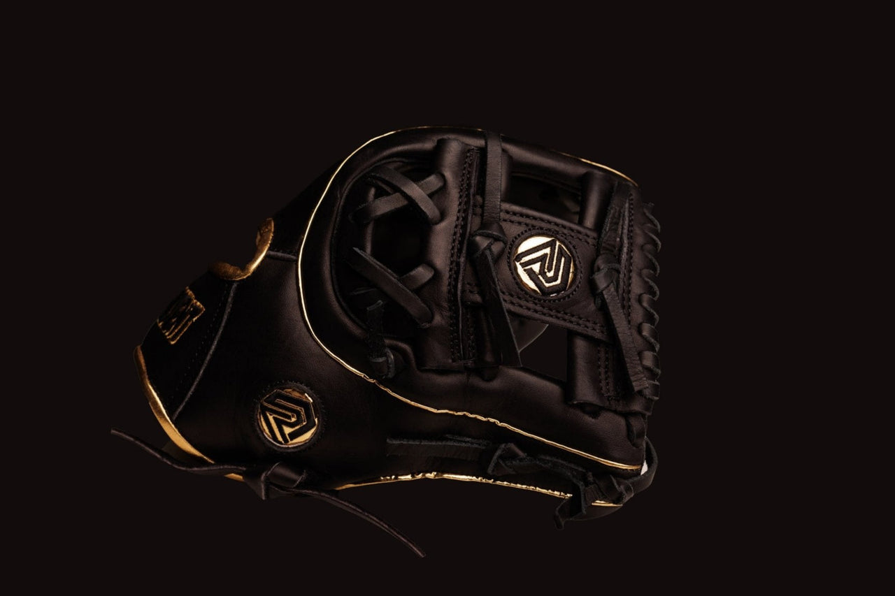 Black baseball glove with gold trim and logos on a dark background.