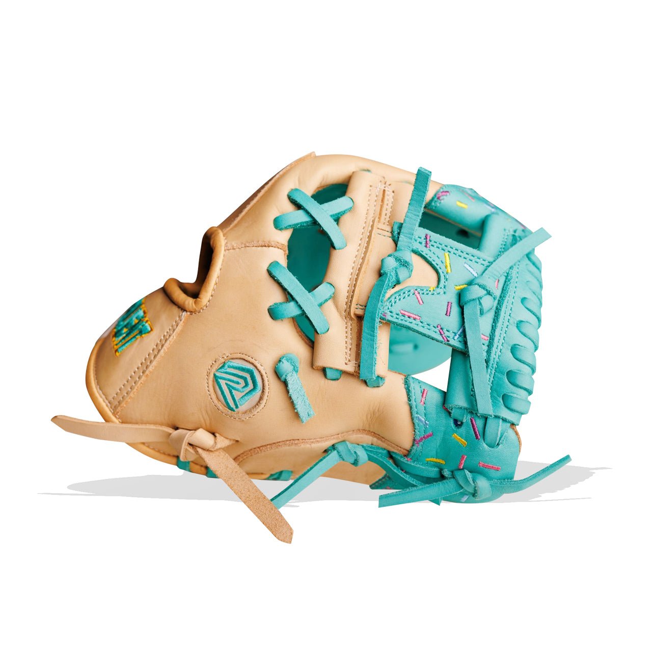 Tan baseball glove with teal laces and accents, some with colorful sprinkles.