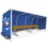 Blue team shelter with "Eagles" logo, white frame, and two wooden benches inside. Wheels on left side.