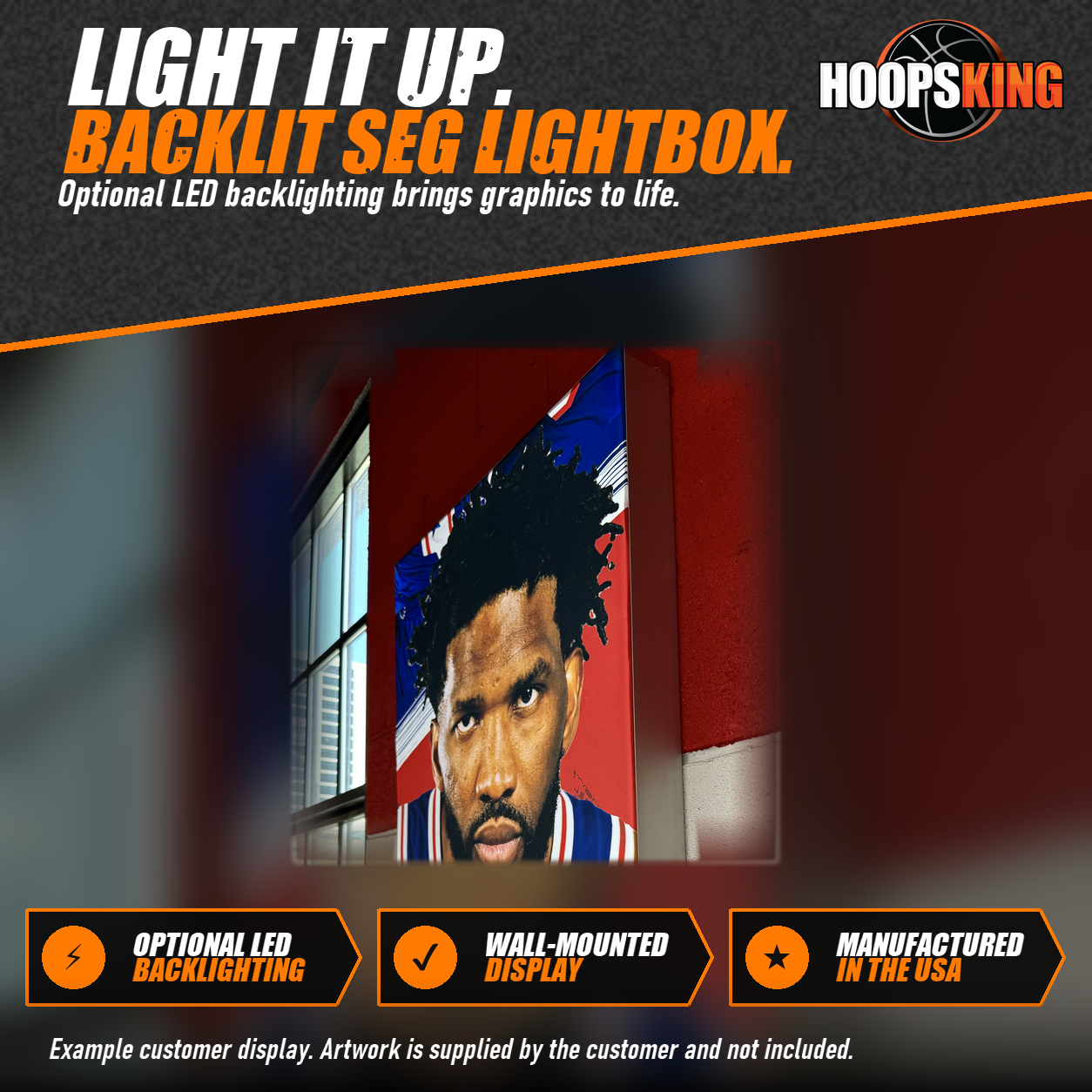 Side view of a deep silicone edge lightbox on a gym wall showing a printed basketball player portrait in a blue jersey