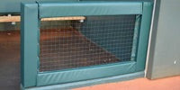Thumbnail for Green square padding framing a dugout rail opening with netting