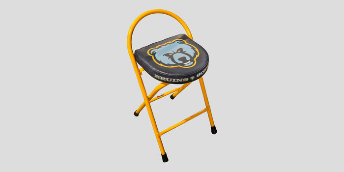 Yellow folding stool with a blue bear logo and "BRUINS" printed on the black seat.