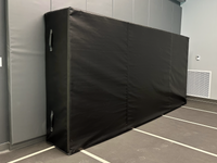 Thumbnail for Close-up view of indoor track landing pad showing foam construction and durable cover material