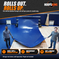 Thumbnail for Two men unrolling a royal blue GymGuard vinyl floor cover from a mobile storage rack onto a hardwood basketball court