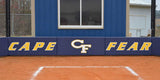 Navy L-shaped backstop wall padding printed with Cape Fear behind home plate