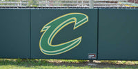 Thumbnail for Close view of a green grommeted fence pad with a printed C logo on a chain link fence