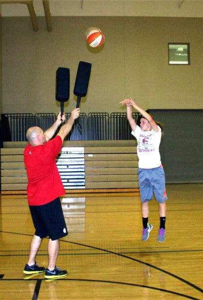 Use the Defender Extender basketball training pads to teach players to shoot over a taller defender in basketball.