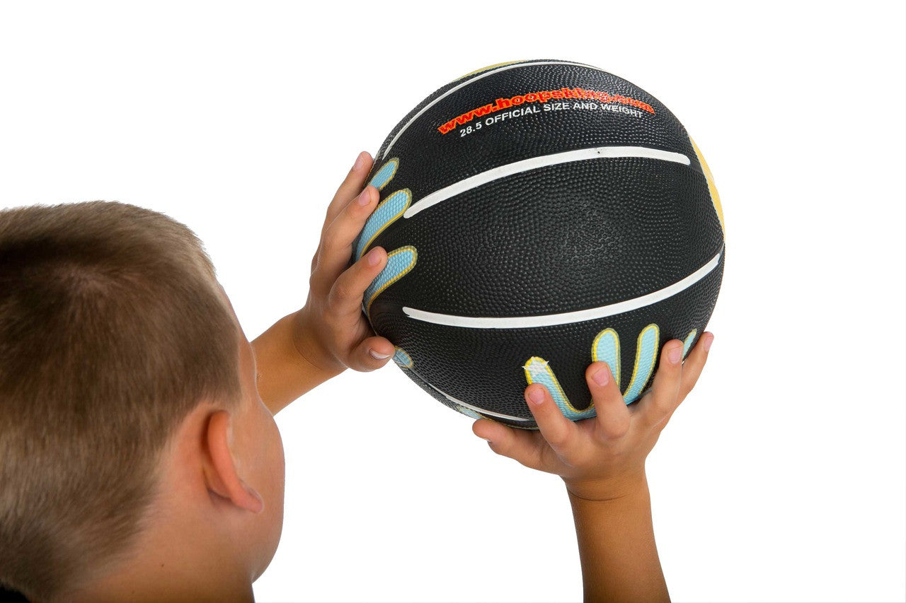 The SkilCoach Shooting basketball is the basketball with the hands on it.