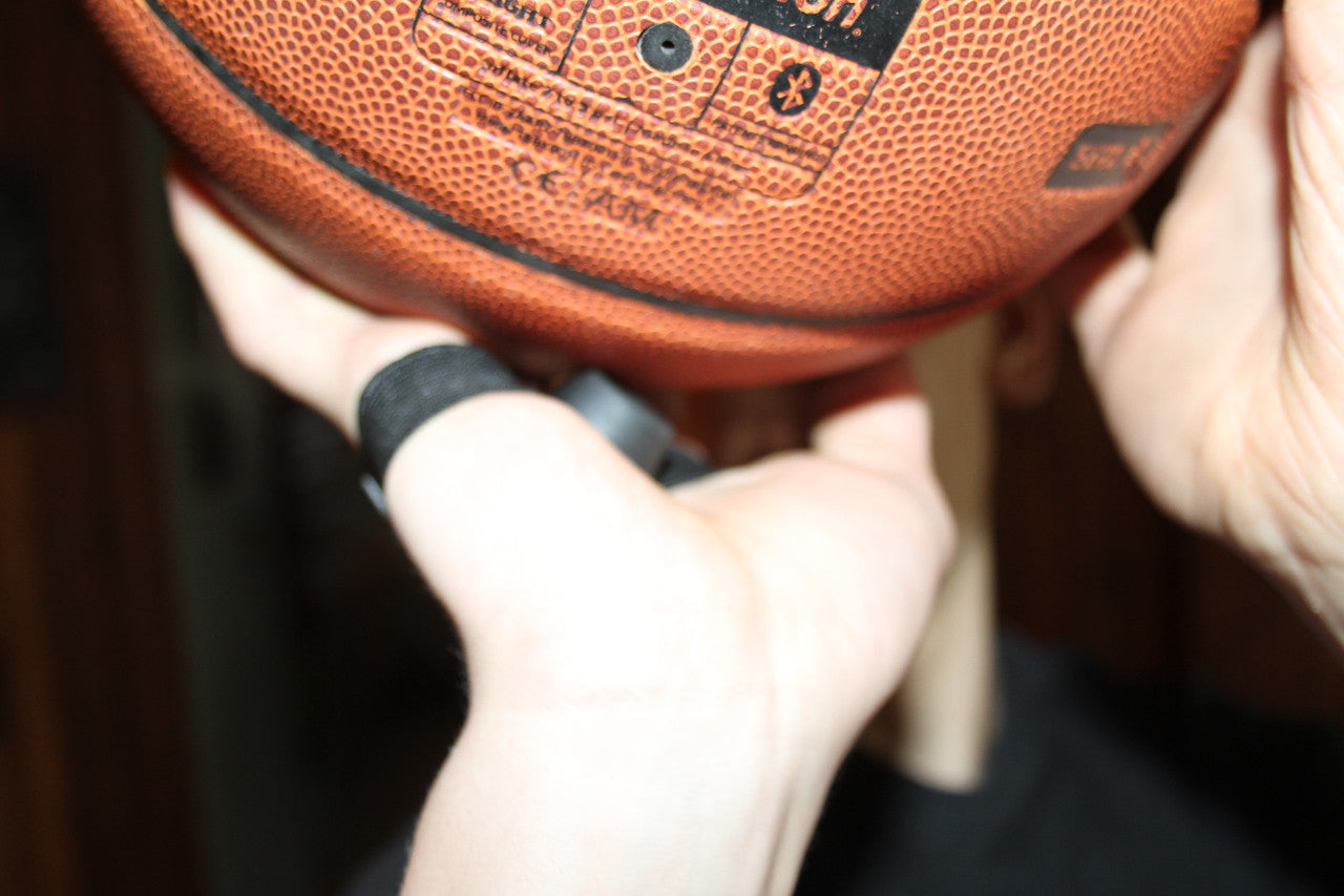 Wear on your shooting hand to help keep the ball of your palm.