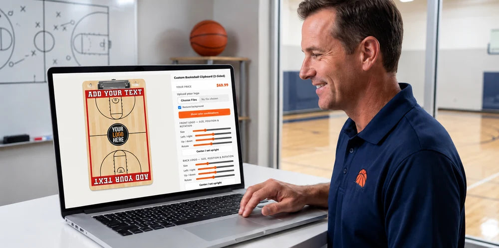 Coach using a laptop to customize a portrait two-sided basketball clipboard with a metal paper clip in the HoopsKing designer