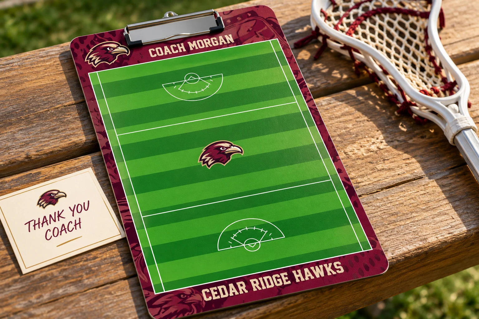 Illustrative Cedar Ridge Hawks lacrosse clipboard personalized for Coach Morgan beside a team card and lacrosse stick